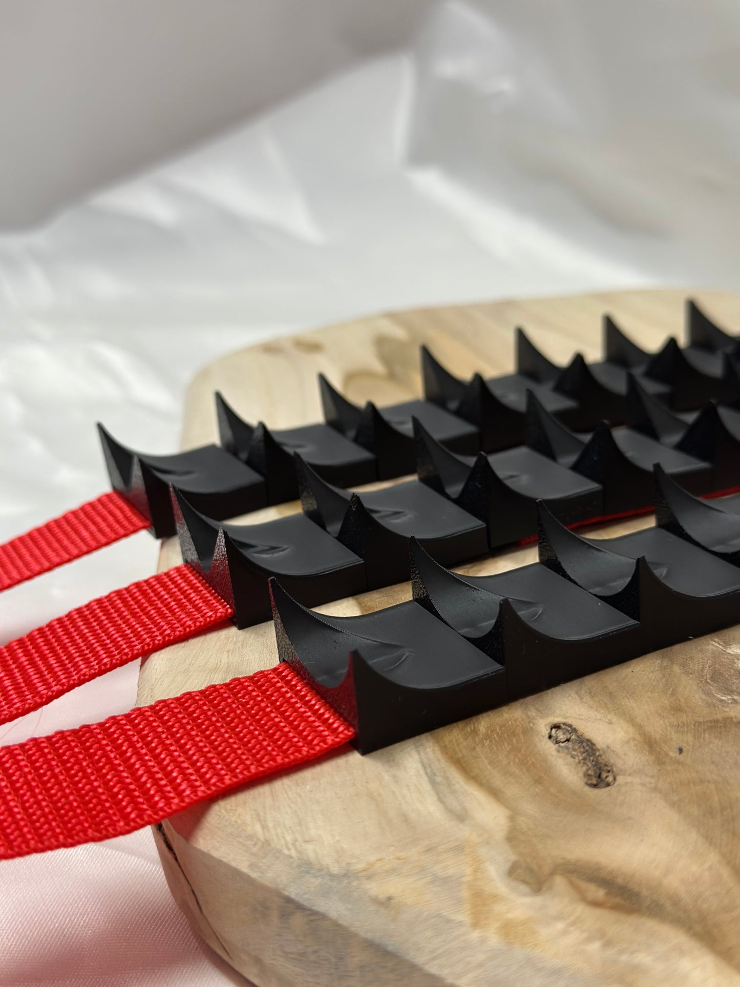 Close-up of cilicium spiked band showing double spike detail and durable strap