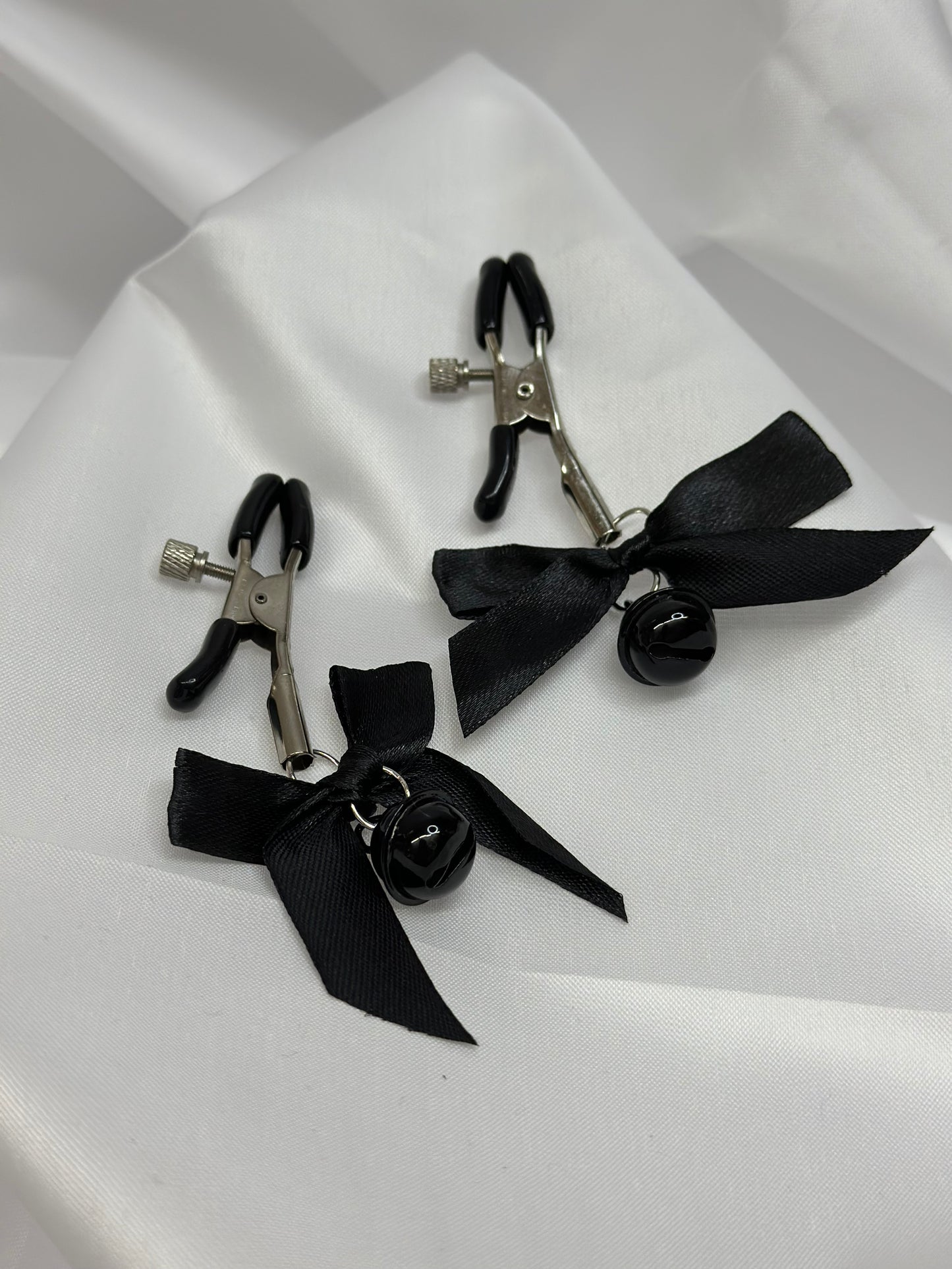 Adjustable metal nipple clamps with bows and bells
