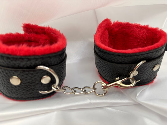 Purple soft faux leather handcuffs with adjustable buckle closure and sturdy metal hardware, perfect for BDSM, roleplay, and cosplay.
