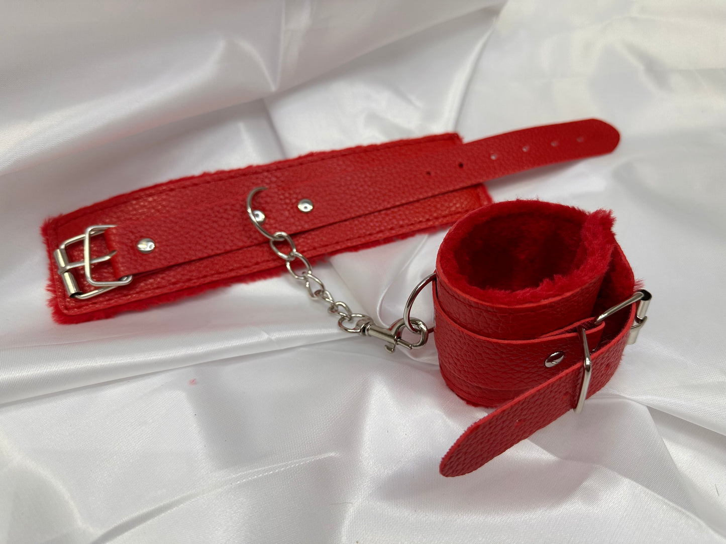 Purple soft faux leather handcuffs with adjustable buckle closure and sturdy metal hardware, perfect for BDSM, roleplay, and cosplay.