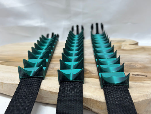 Close-up of cilicium spiked band showing double spike detail and durable strap