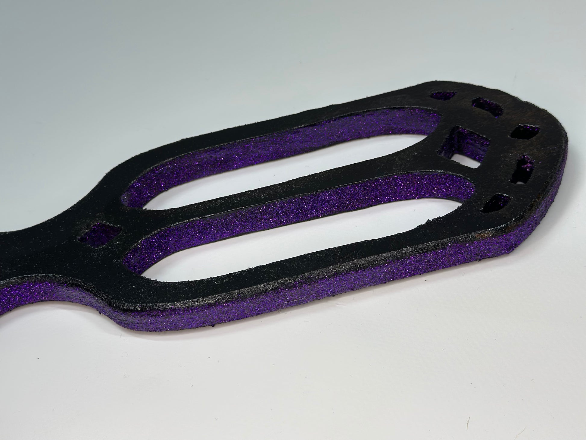 Handmade Gothic Glitter Cathedral Spanking Paddle with intricate cut-outs and a dazzling finish. Crafted from premium hardwood for durability and precision impact. A perfect blend of elegance, artistry, and intensity for both play and display.