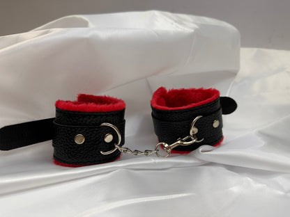 Purple soft faux leather handcuffs with adjustable buckle closure and sturdy metal hardware, perfect for BDSM, roleplay, and cosplay.