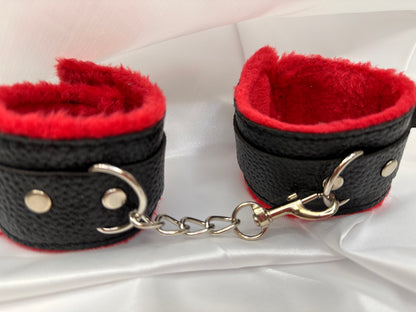 Purple soft faux leather handcuffs with adjustable buckle closure and sturdy metal hardware, perfect for BDSM, roleplay, and cosplay.