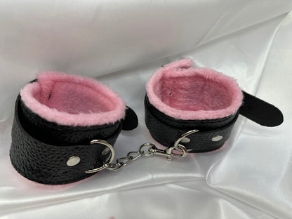 Purple soft faux leather handcuffs with adjustable buckle closure and sturdy metal hardware, perfect for BDSM, roleplay, and cosplay.
