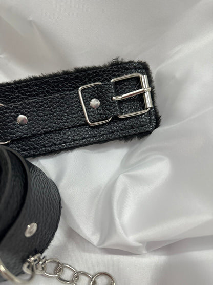 Purple soft faux leather handcuffs with adjustable buckle closure and sturdy metal hardware, perfect for BDSM, roleplay, and cosplay.
