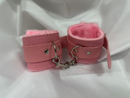 Purple soft faux leather handcuffs with adjustable buckle closure and sturdy metal hardware, perfect for BDSM, roleplay, and cosplay.
