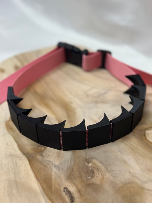 Close-up of cilicium spiked band showing double spike detail and durable strap