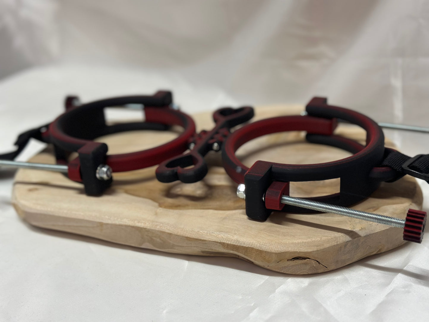 3D printed adjustable breast press bondage restraint with nylon strap for BDSM sensory and fetish play.