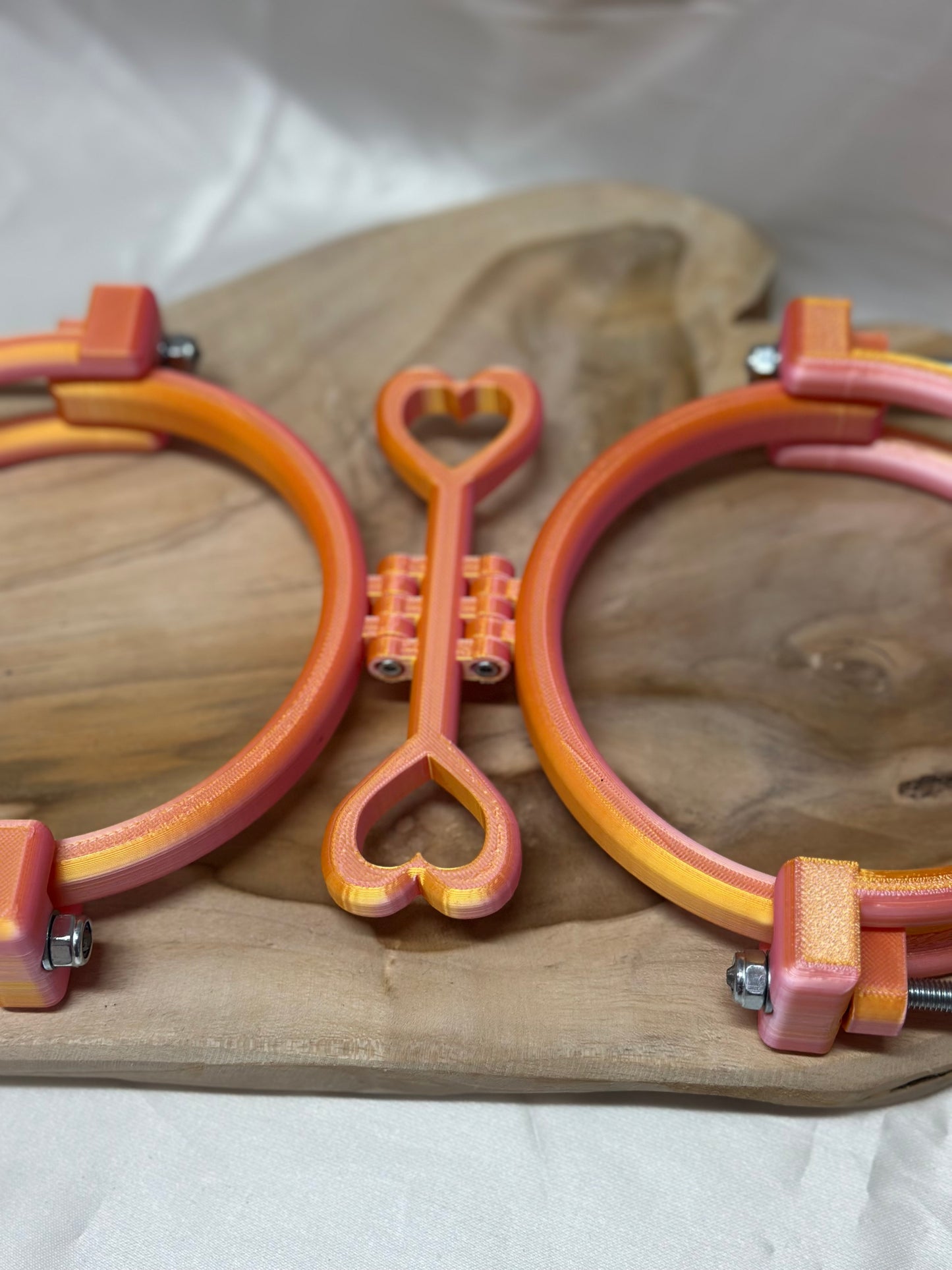 3D printed adjustable breast press bondage restraint with nylon strap for BDSM sensory and fetish play.