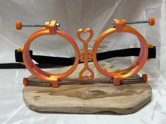 3D printed adjustable breast press bondage restraint with nylon strap for BDSM sensory and fetish play.