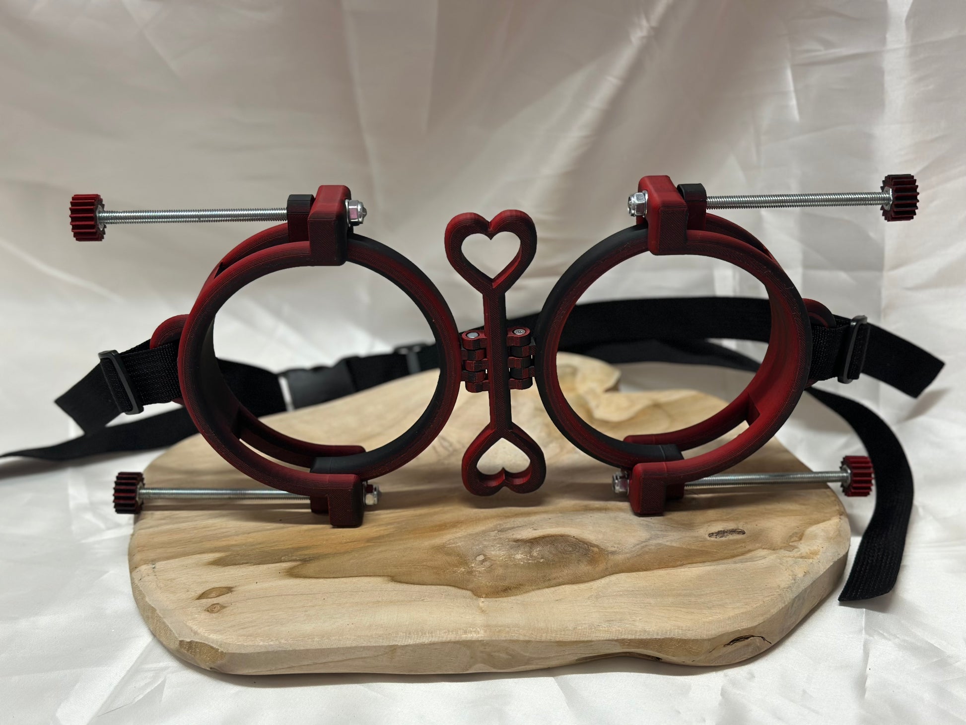 3D printed adjustable breast press bondage restraint with nylon strap for BDSM sensory and fetish play.