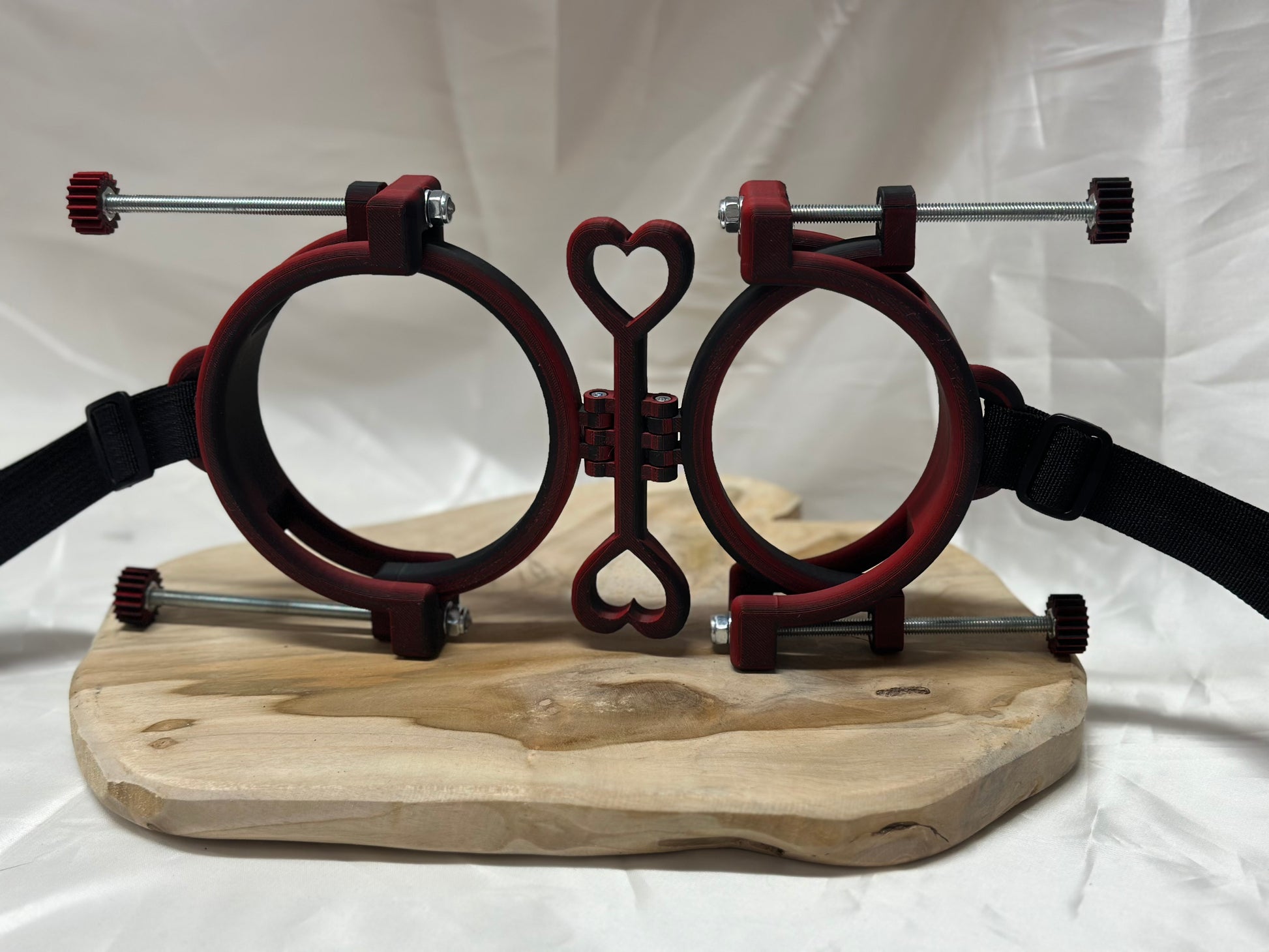 3D printed adjustable breast press bondage restraint with nylon strap for BDSM sensory and fetish play.