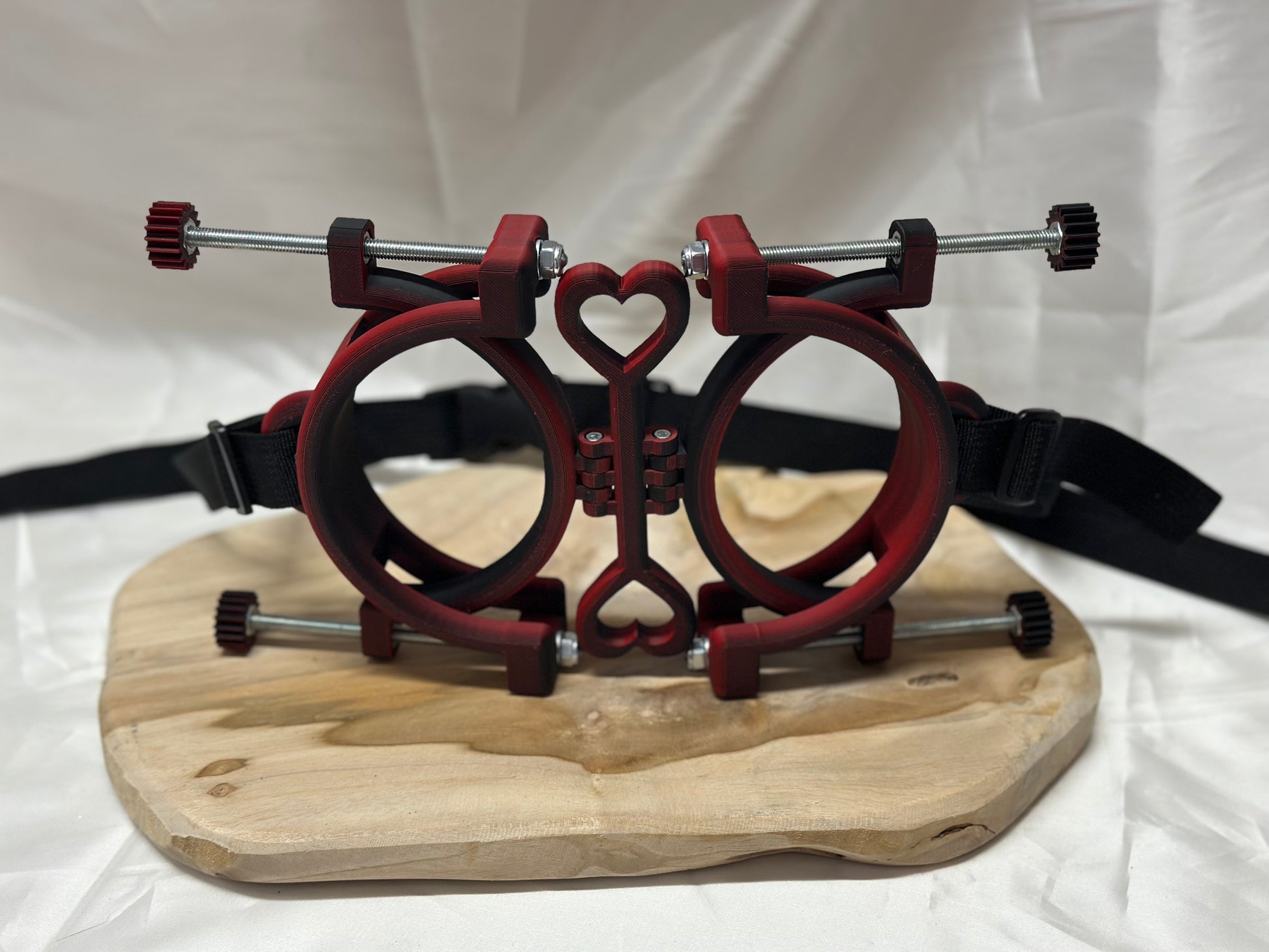 3D printed adjustable breast press bondage restraint with nylon strap for BDSM sensory and fetish play.