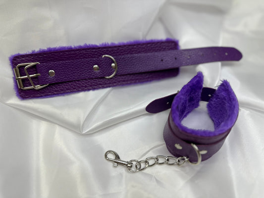 Purple soft faux leather handcuffs with adjustable buckle closure and sturdy metal hardware, perfect for BDSM, roleplay, and cosplay.