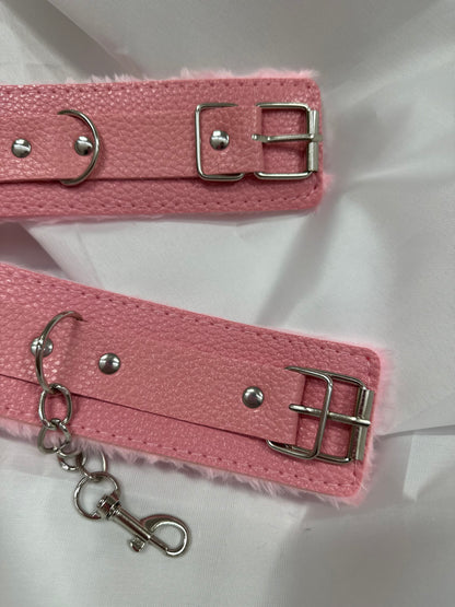 Purple soft faux leather handcuffs with adjustable buckle closure and sturdy metal hardware, perfect for BDSM, roleplay, and cosplay.