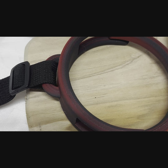 3D printed adjustable breast press bondage restraint with nylon strap for BDSM sensory and fetish play.